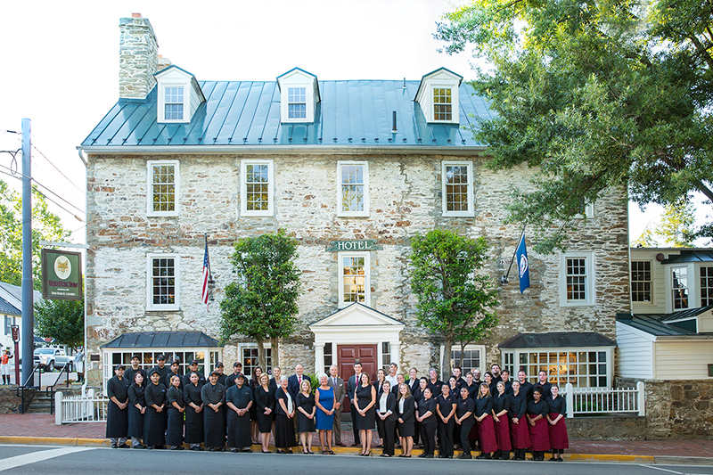 Red Fox staff in front of building