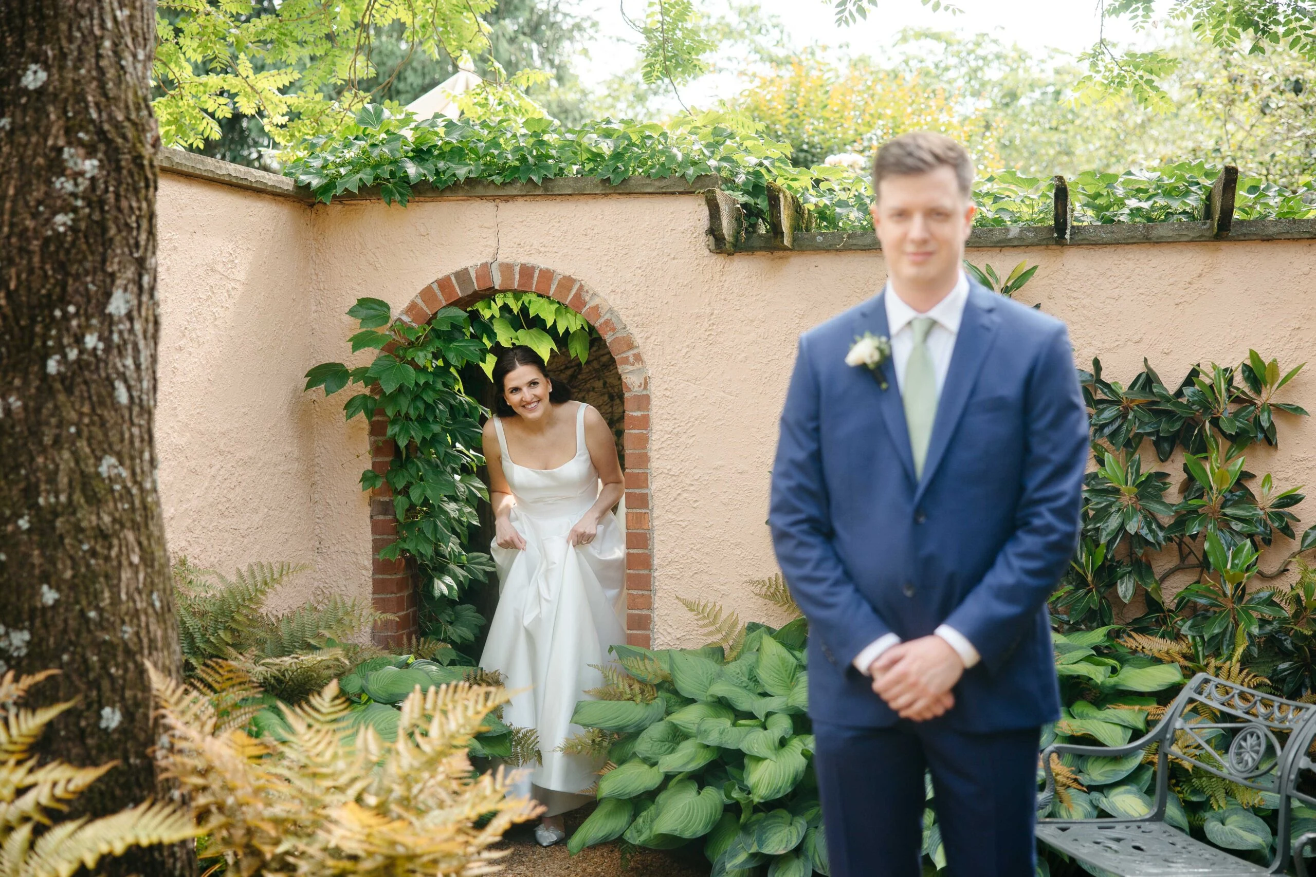 Wedding couple smiling in garden setting at The Red Fox Inn & Tavern.