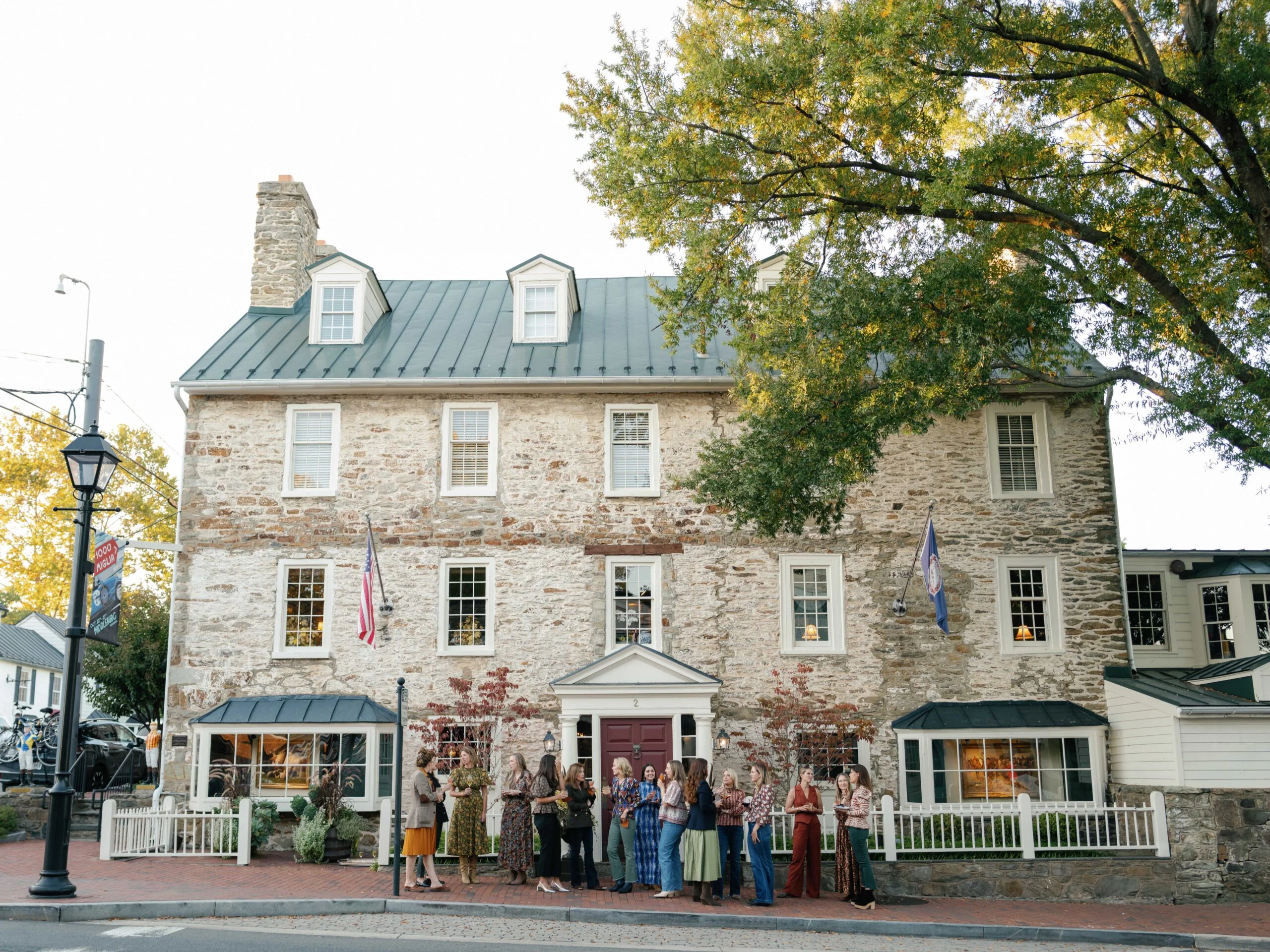 Charming historic inn and tavern with outdoor gathering space, perfect for social events and dining.