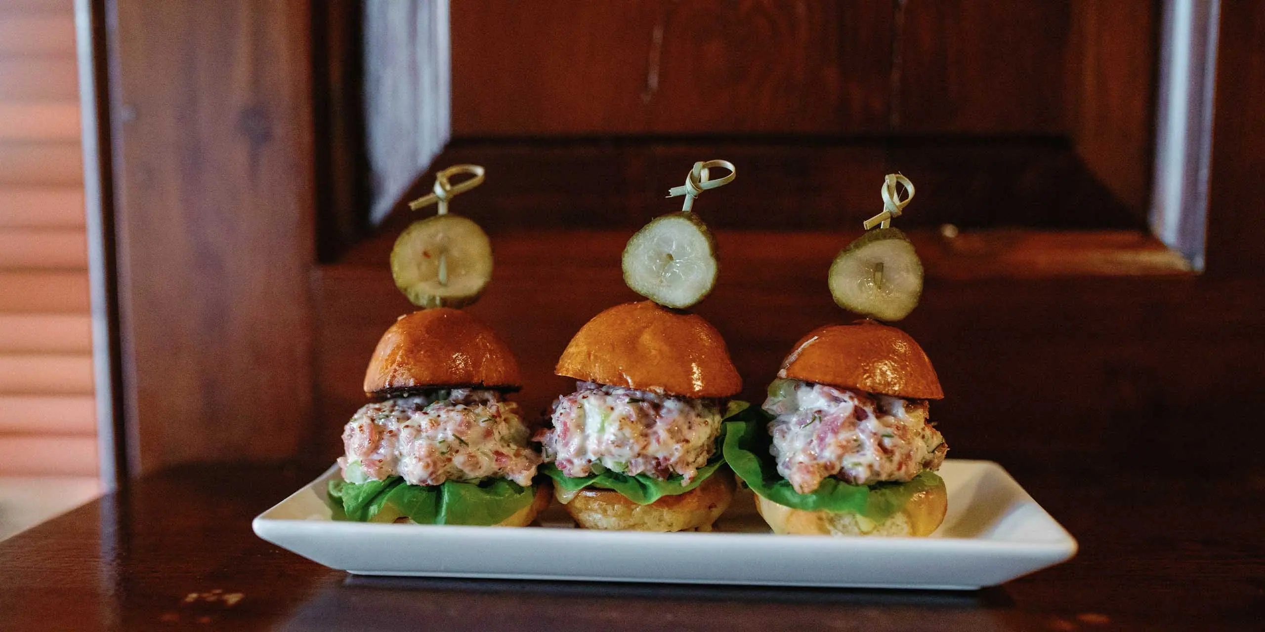 Delicious crab salad sliders with fresh cucumber and lettuce, perfect for a festive parade celebrati.