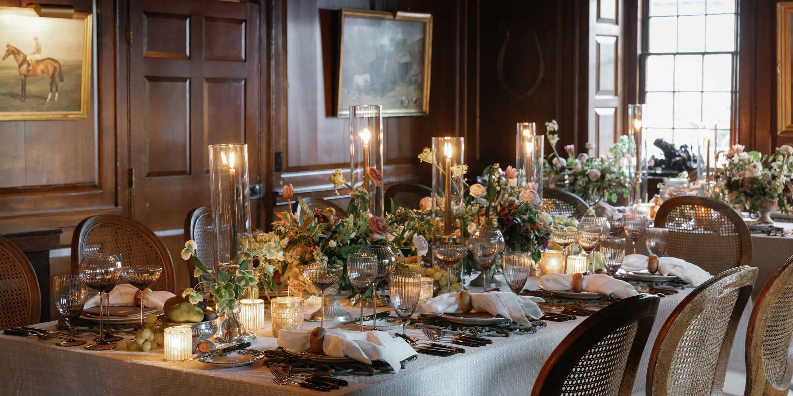 Elegant dining setup with floral centerpieces and candlelit ambiance at The Red Fox Inn & Tavern.