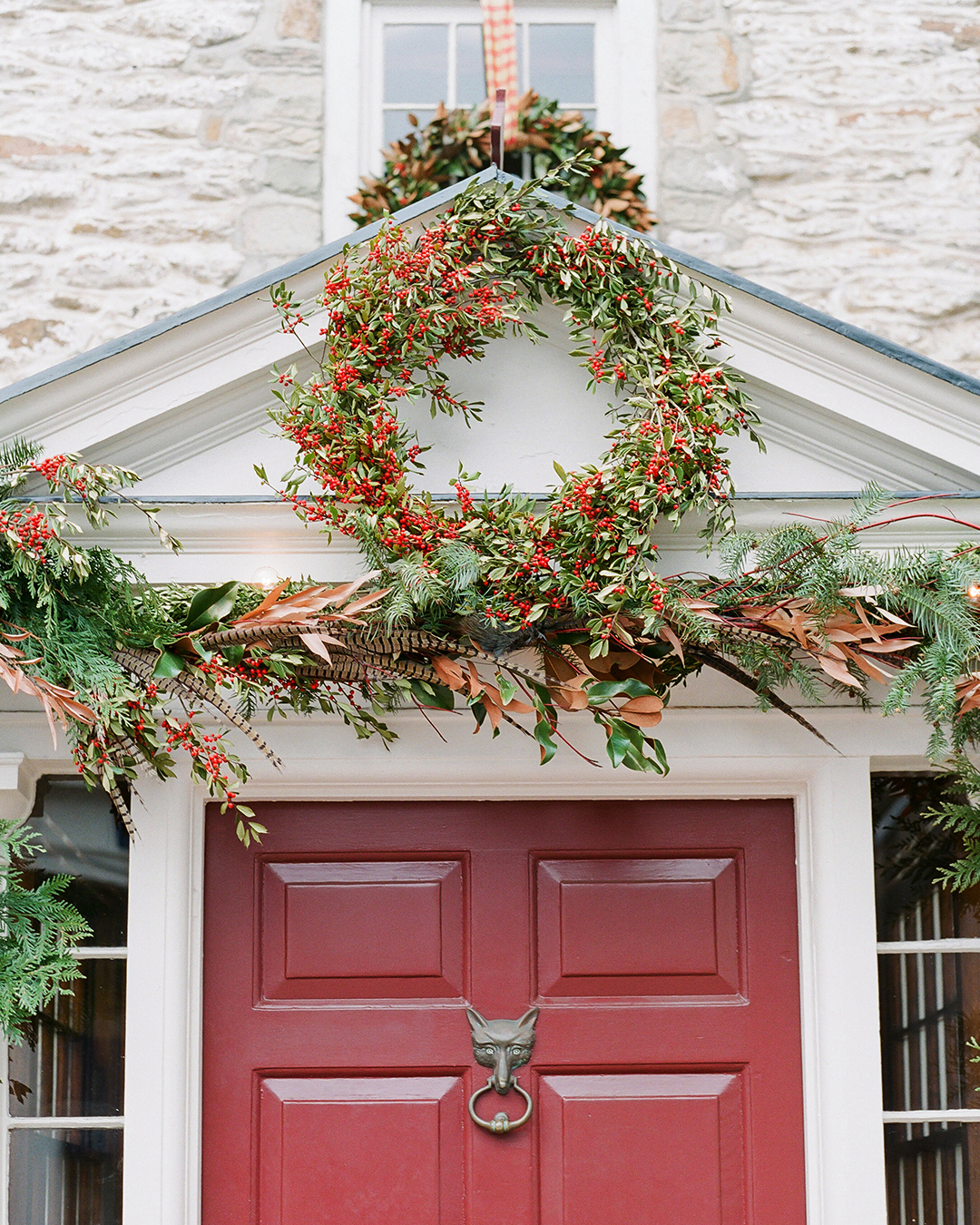 Festive wreath and greenery adorn the entrance of The Red Fox Inn & Tavern.