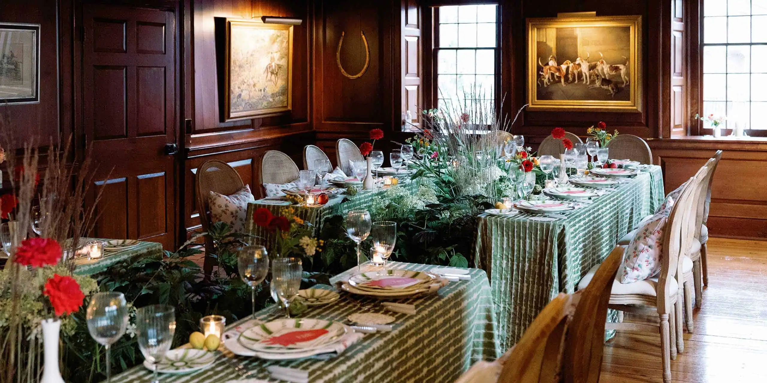 Charming interior of The Red Fox Inn & Tavern with elegant wooden paneling and classic artwork.