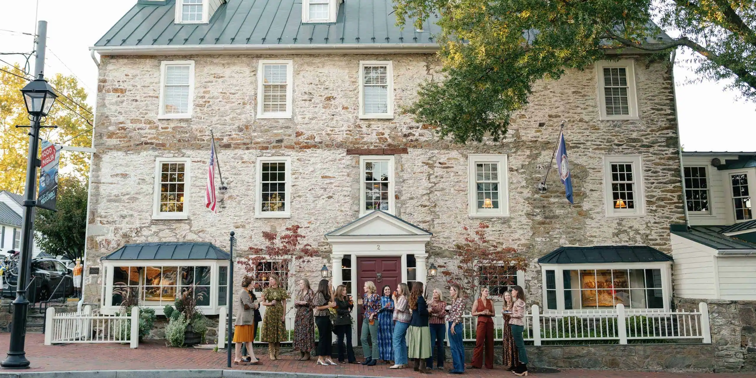 Historic inn and tavern in Middleburg, VA, featuring stone facade, cozy windows, and welcoming ambia.