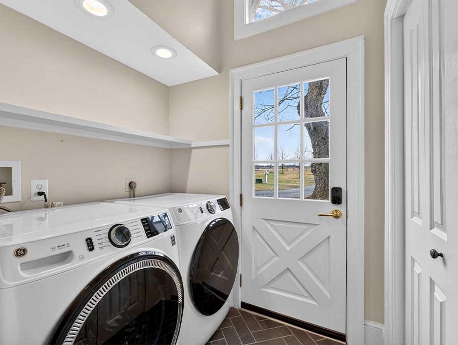 Laundry area at Cedar Cottage with washer and dryer.