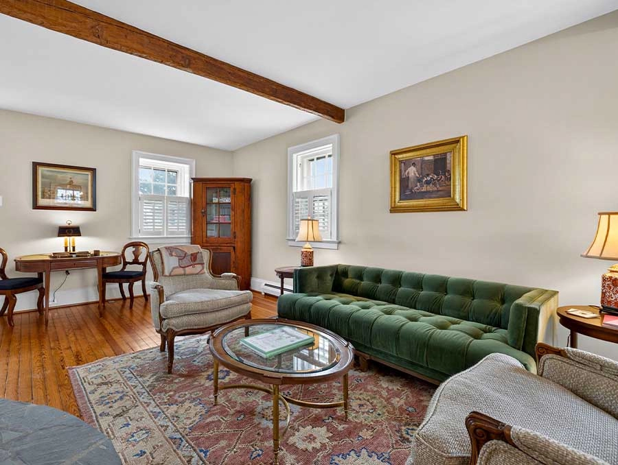 Charming Cedar Cottage living room with vintage furniture and cozy ambiance. Perfect for relaxing st.