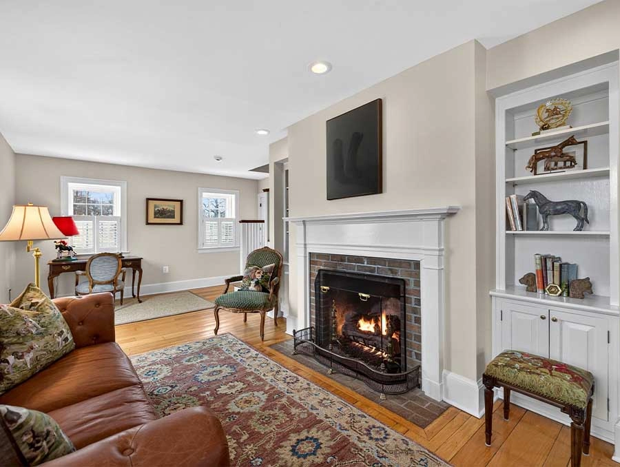 Cozy living room with fireplace, classic furniture, and elegant decor at The Red Fox Inn & Tavern.