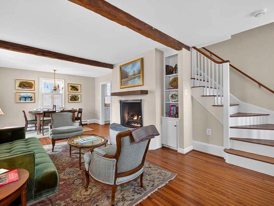 Inviting living room with fireplace and classic furniture at The Red Fox Inn & Tavern.