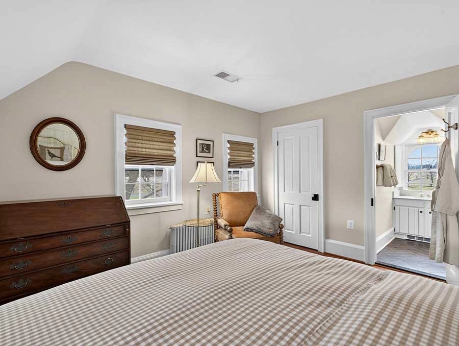 Cozy bedroom at The Red Fox Inn & Tavern with classic decor and natural light.