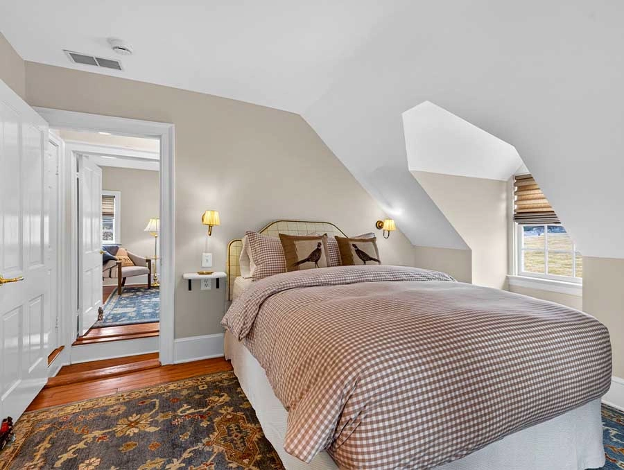 Comfortable bedroom with a large bed and soft bedding at The Red Fox Inn & Tavern.