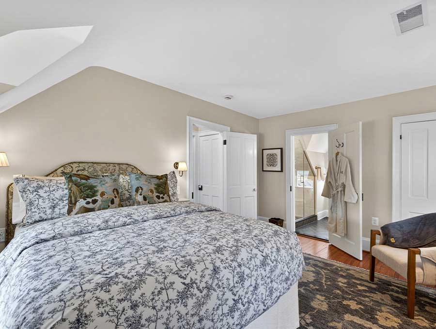 Comfortable bedroom with elegant decor at The Red Fox Inn & Tavern. Perfect for a relaxing stay in a.