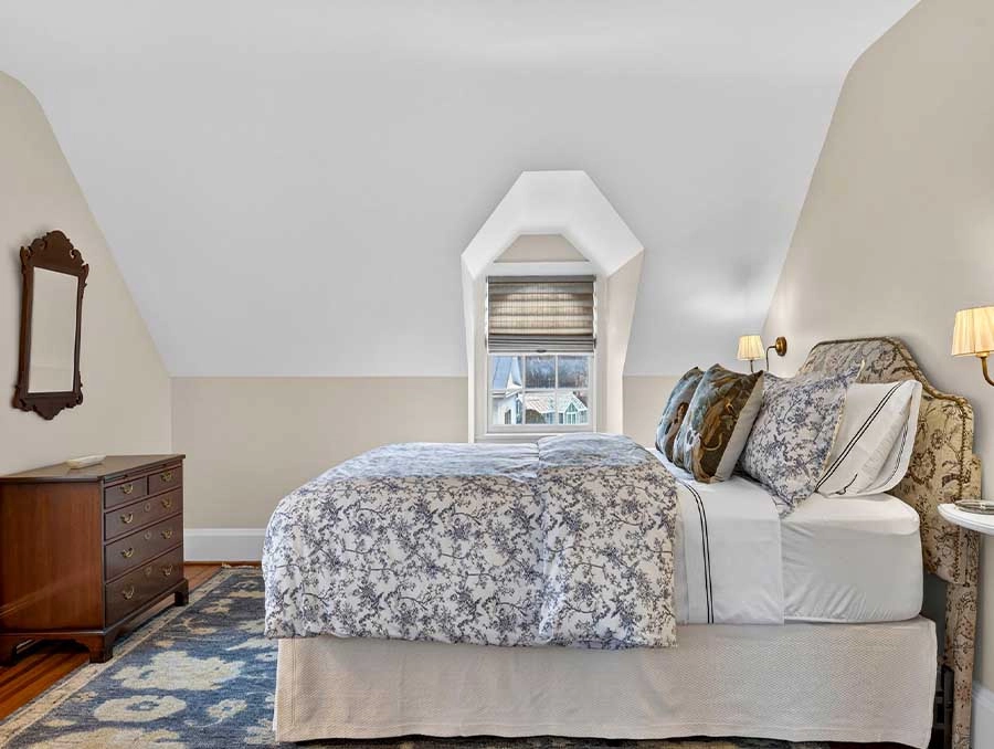 Comfortable bedroom with elegant decor at The Red Fox Inn & Tavern. Perfect for a relaxing stay in a.
