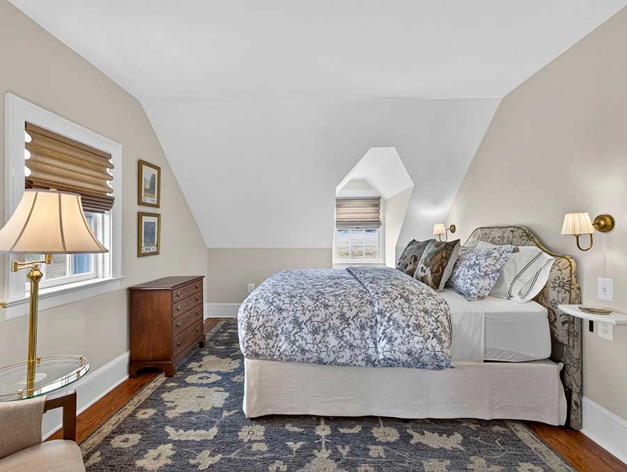 Interior view of a cozy bedroom at Azalea Cottage with elegant decor.