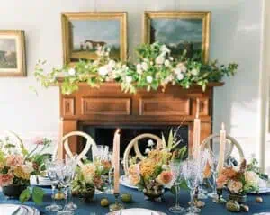 Elegant dining table setup with floral arrangements and candles at The Red Fox Inn & Tavern.